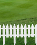 48 Count White Classic Garden Fence Panels With Fence Inserts For Yard Upgrade And Border Edging in a grassy lawn background.