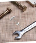 15-Piece Beefed-Up Metal Toggle Bolt Kit With Wing Nuts For Drywall Anchors lying on textured surface with wrench