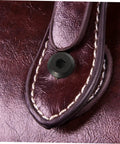 Tough As Nails M6x25 Stainless Steel Binding Post Screws For Leather Bags And Saddle Work showing close-up of black socket cap fastener on leather.