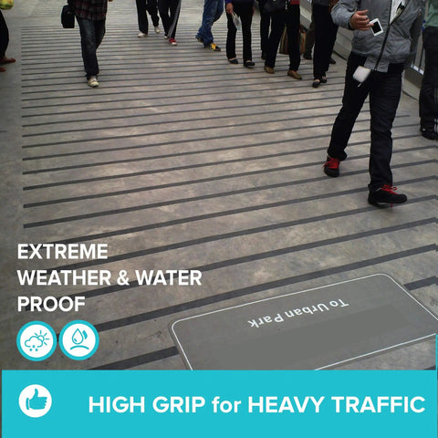 Anti Slip Traction Tape 2 Inch By 38 Foot Durable Non Slip Grip For Stairs Treads Indoor Outdoor Heavy Foot Traffic With Strong Adhesive For Steps Deck Garage And Home Safety For Everyday Safe Use in use on busy walkway with high foot traffic.