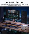 Four Bay USB C External Hard Drive Enclosure For 2.5 And 3.5 Inch SATA HDD Or SSD Drives on a modern desk with dual monitors.