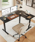 63-Inch L-Shaped Standing Desk With Built-In Power Outlets And Large Power Strip Holder, Black, in home office with monitors
