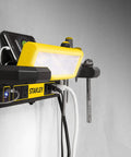 Adjustable 45 COB LED Workbench Light with 1000 lumens, built-in AC outlets, USB ports, tool storage, mounted on a wall