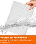 Hand holding Poly Bubble Mailer 8.5x12 Inches Self Seal with three sixteenths inch air bubble interior, tear-resistant white and grey
