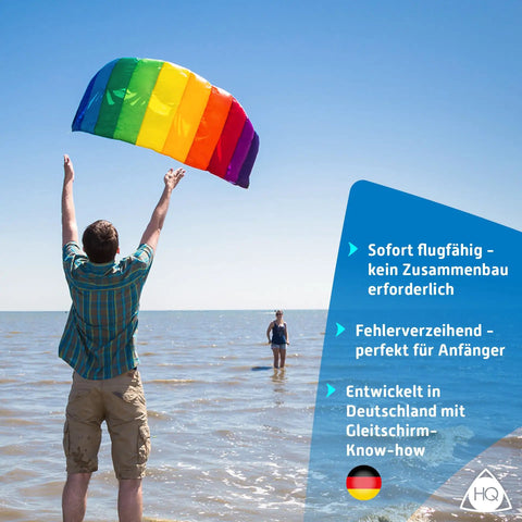 Person flying Rainbow 2.2 Stunt Kite For Beginners And Beyond Dual Line Foil Sport Kite Easy Setup Smooth Handling on beach