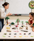Teacher using Rainforest Diorama Kit With 33 Pieces PVC Animals And Insects, Miniature Trees, Moss, Sand And Stones for a lesson