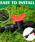 Close-up of Fifty Foot Half Inch Drip Irrigation Tubing Kit With Switch Valves on green grass, showing installation process.