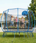 Kids playing on a large backyard trampoline with safety net enclosure.