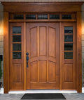 Wooden front door with side panels and decorative lights