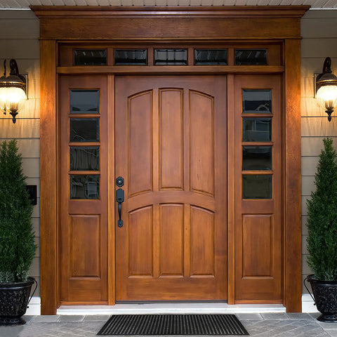 Wooden front door with side panels and decorative lights