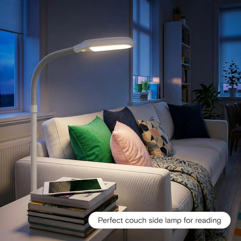 Litespan LED Floor Reading Lamp For Over Chair Tasks And Lash Extensions next to sofa, adjustable neck, white finish, warm glow at night.