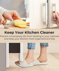 Hands using under cabinet foot pull for trash drawer opener with adhesive strips and screws white, hands-free kitchen solution.