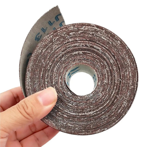 High Performance 400 Grit Sandpaper Roll In 2 Inch By 32 Point 8 Foot Length showing flexible sanding roll held in hand.