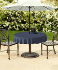 60 Inch Round Outdoor Tablecloth With Umbrella Hole And Zipper Navy Textured Water Repellent Polyester Cover For 2 To 4 Seater Tables Durable Patio Table Cover For Backyard Garden Easy Care shown on a garden table with chairs and white umbrella