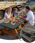 Family using fitted picnic tablecloth 3 piece set with bench covers and built-in storage pouch, ideal for outdoor meals.