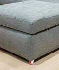 Six Pack Of Two Inch Rigid Rubber Casters With Steel Mounting Plate Heavy Duty Silent Rolling Wheels For Furniture Cart Workbench on a grey couch.