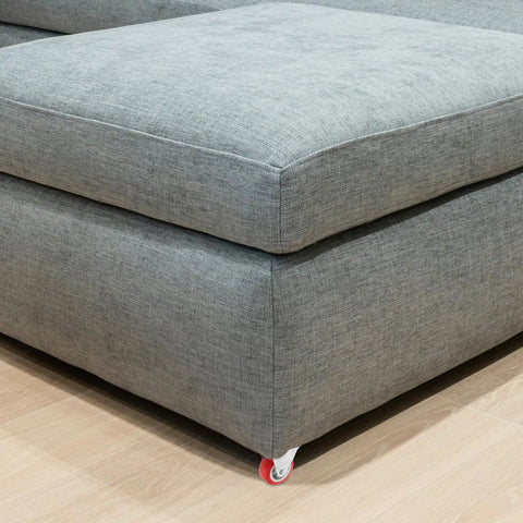 Six Pack Of Two Inch Rigid Rubber Casters With Steel Mounting Plate Heavy Duty Silent Rolling Wheels For Furniture Cart Workbench on a grey couch.
