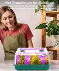 Person beside a 96 Cell Seed Starter Tray With Grow Light Kit For Seed Starting, featuring full spectrum LED light and humidity dome indoors.