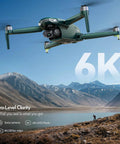 Elite 6K Drone With Camera And 4K 30fps Three-Axis Brushless Gimbal 70 Minute Flight Time flying over mountainous terrain