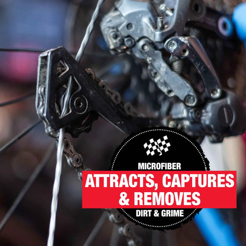 Close-up of bike derailleur pulley with Microfiber Cleaning Rope For Bikes, A Detailing Tool That Reaches Tight Spaces On Cassettes.