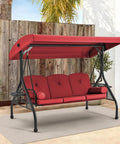 Three Seat Outdoor Porch Swing With Adjustable Canopy Convertible Patio Swing Bed With Stand Glider Swing With Upgraded Cup Holder And Thick Cushions For A Cozy Backyard Vibe In Wine Red displayed on a patio with plants.