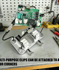 Khbyt Heavy Duty Aluminum Welding Clamp With 4 Strong Magnets securing electronic circuit board in place during repair tasks.