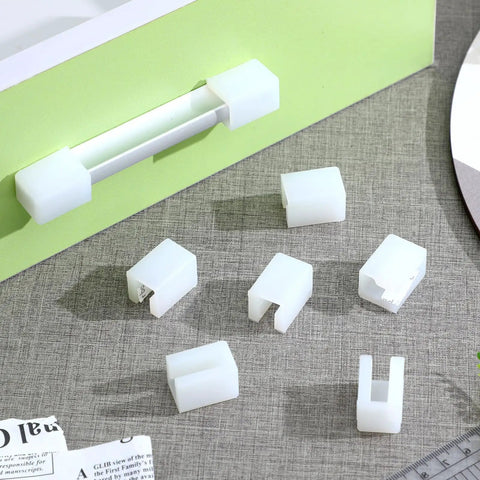 8 Pack Silicone Corner Guards For Safety And Soft Edge Protection On Desks And Furniture F Shape Edge Protectors placed on drawer handles