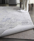 Non Slip Rug Pad Basic Grey Cushioned Underlay Keeps Rugs From Slipping, Wrinkling, And Floor Scratches, Cut To Fit 1 Foot 8 Inches By 3 Feet 4 Inches shown under a rug
