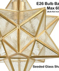 Close-up of handcrafted Brass Moravian Star Pendant Light with seeded glass shade and warm gold star design, 11 inch size.