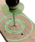 BullseyeBore Core CG1-101 drill guide with magnetic base and green laser ring on wood