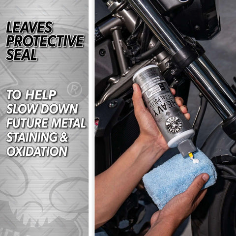 Person applying Heavy Metal Polish Restorer And Protectant For Chrome Aluminum Stainless Steel Brass Silver And More Cleans Restores