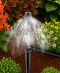 10 Pack Adjustable Sprinkler Bubbler Heads For 1/2 Inch Male Thread With Mushroom Design shown installed in garden
