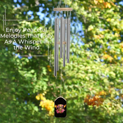 Mask Inspired Hawaiian Flowers Wind Chimes With Six Tuned Aluminum Tubes For Outdoor Decor Garden Patio Balcony Good Vibe Weatherproof Aluminum Build With Wooden Tags And Sturdy Hangers hanging against leafy background.