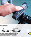 Person activating lock mode on Lumina Micro 850 Front Bike Light USB Rechargeable LED Water Resistant, Great For Mountain, Road, City Commutes And Urban Cycling Safety Flashlight, Black.