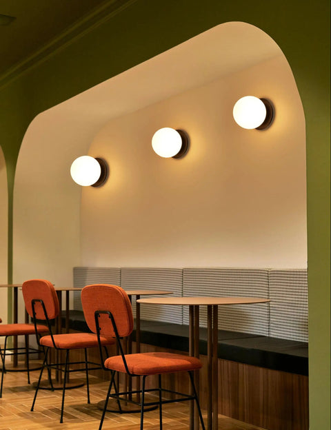Matte Black Modern Globe Wall Sconce 1 Light With Opal Glass Shade in hallway seating area