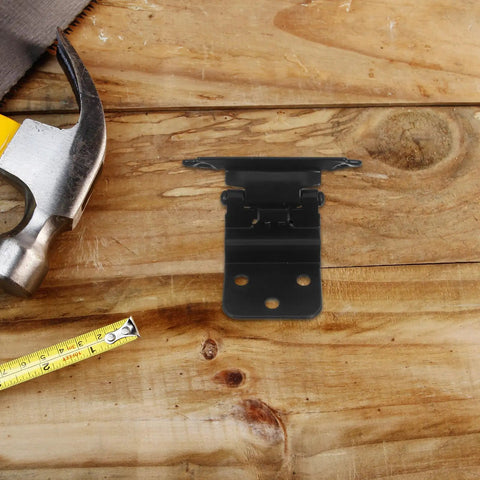 Self Close Spring Door Hinge 3 By 8 Inch Metal Cabinet Hinge Black Auto Closing lying on wooden surface with tools around