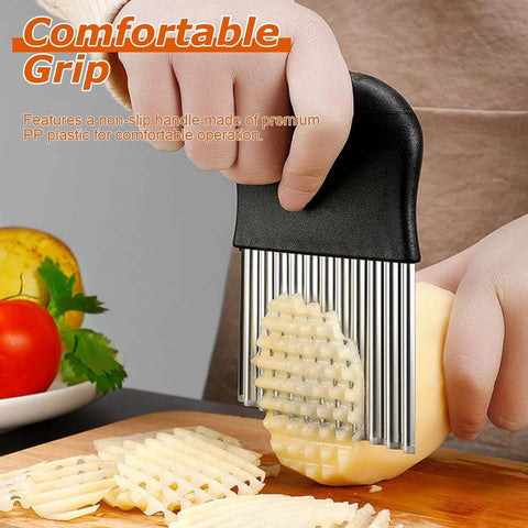 Waffle fry cutter with black handle and stainless steel blades cutting a potato into waffle fries