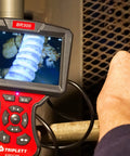Person using Forward View Pro Grade Waterproof 5.5mm Videoscope With 5 Inch 1920x1080 Color LCD Display in inspection.