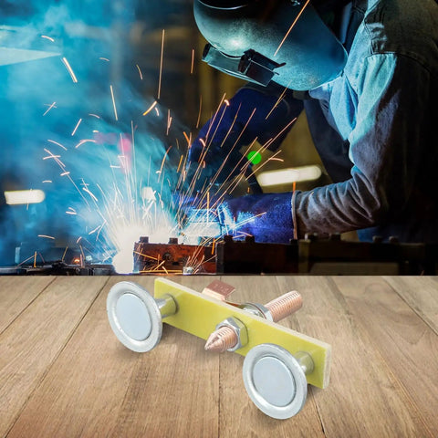 Solid Double Head Magnetic Welding Clamps With Heavy Duty Adsorption And Grounding That Grip Tight For Professional Jobs, No More Slippage When You Need Them Most To Clamp Up To 3 Kg Securely Every Single Time with sparks in background.