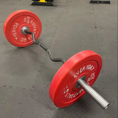 Olympic Curl Bar 47 Inch Barbell With 2 Inch Diameter Chrome Plated Heavy Duty Bar with red weights in home gym setting