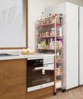 Premium Six Tier Rolling Storage Cart With Swivel Wheels, Sturdy Metal Mobile Shelving Rack For Tight Spaces in a modern kitchen.