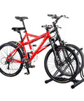 Mighty Rack Two Bike Floor Stand For Easy Clamp-Free Bicycle Parking, holding two bikes, tubular steel, in garage setting.
