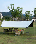 Waterproof Sun Shield Tarp For Camping And Outdoor Events With UPF 50 Plus Sun Protection And Fully Taped Seams shown set up outdoors