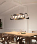 Mid Century Modern Geometric Chandelier With Black And Gold Accents In Age Brass Finish above dining table