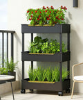 Hydroponics Growing System With Vertical Raised Garden Bed On Wheels For No-Fuss Mobility, Drainage And Breathable Grid For Rapid Plant Growth, Multi Level Towers For Patio Backyard Or Kitchen Use, Black 3 Layer with plants on balcony