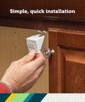 Bulletproof Spring Loaded Cabinet And Drawer Latches 10 Pack White Baby Proofing Essentials for Sneaky Toddlers being installed on a cabinet.
