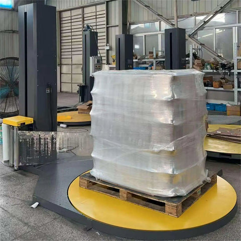 Industrial Strength Automatic Pallet Wrapping Machine Featuring Heavy Duty Turntable, wrapping palletized load with stretch film.