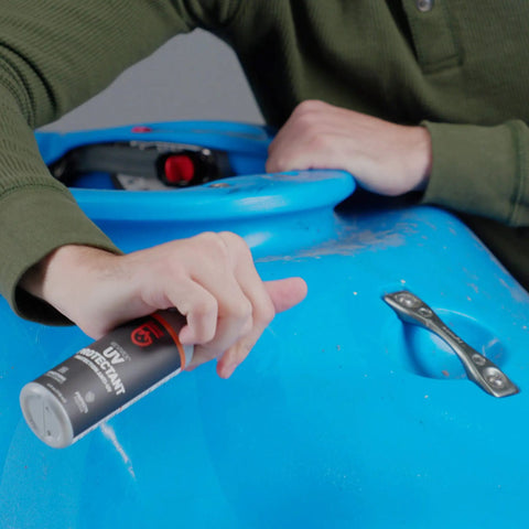 Person uses Outdoor Gear UV Protectant and Conditioner Spray for Plastic, Vinyl, and Neoprene That Shields Against Sun Damage on kayak