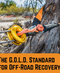 G.O.L.D. Snatch Recovery Ring for Off Road Recovery, 48,000 Lbs MBS connected to winch line and tree in rough terrain
