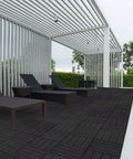 Interlocking Deck Tiles Waterproof Outdoor Flooring 12x12 Inches Gray 27 Piece Set by poolside with lounge chairs